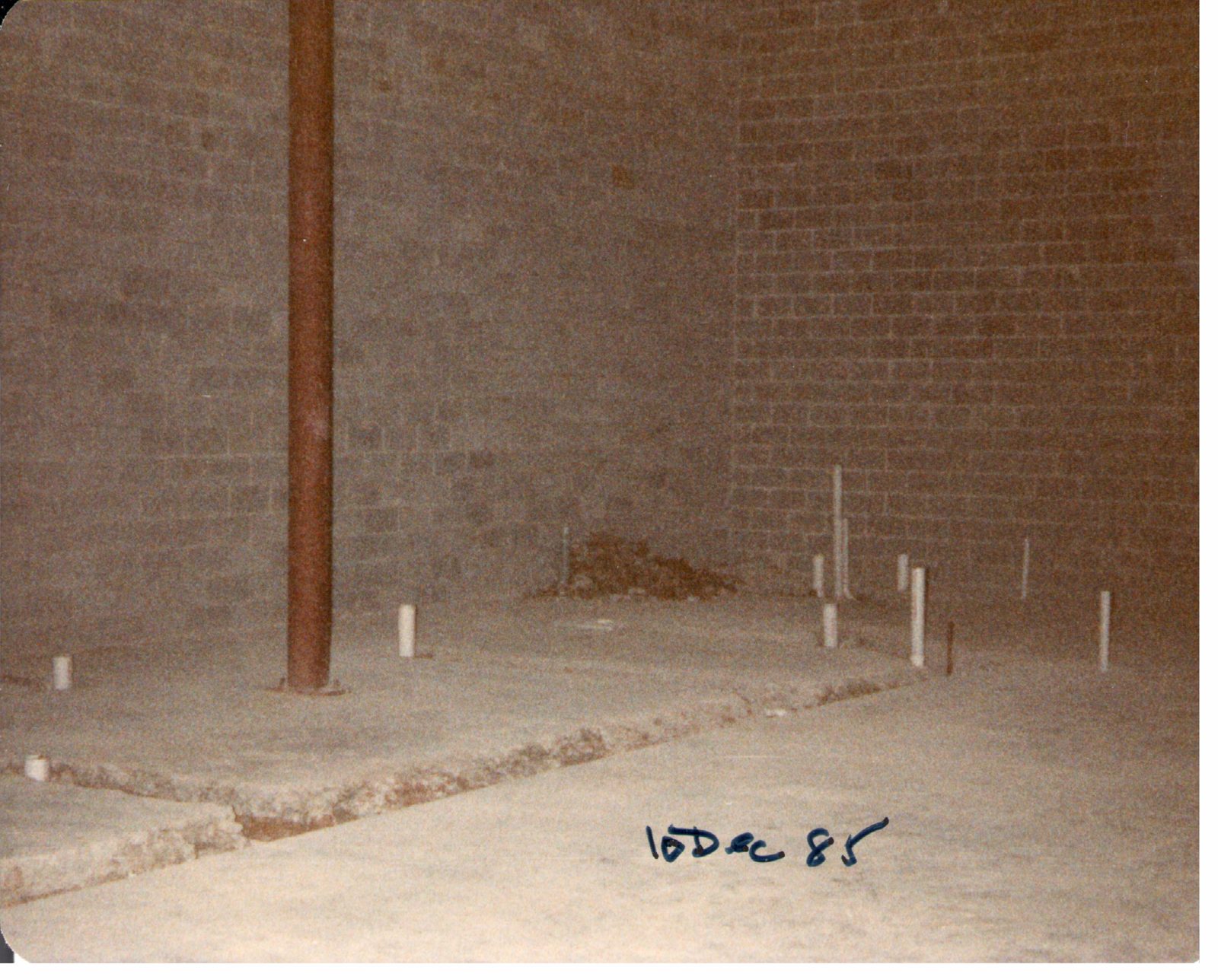 Inside: one steel column and a bare block wall.